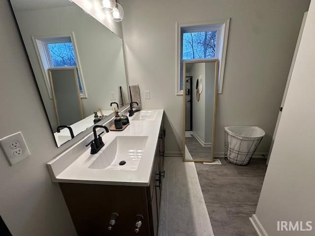 bathroom featuring vanity and hardwood / wood-style flooring