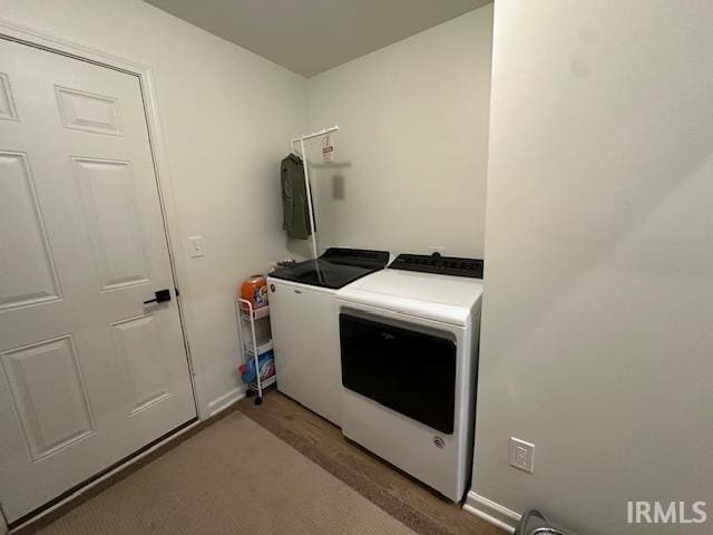 clothes washing area featuring washing machine and clothes dryer