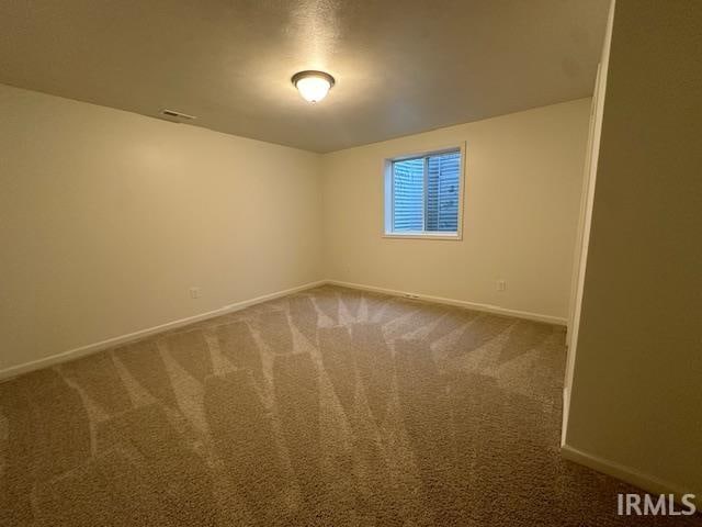 unfurnished room featuring carpet floors