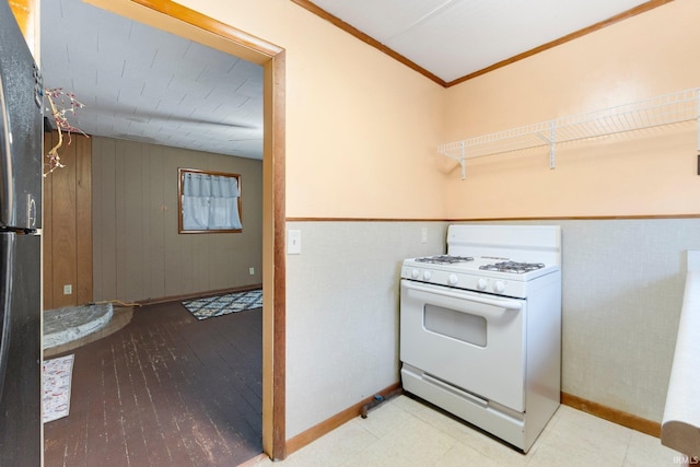 laundry area featuring ornamental molding, wooden walls, and light hardwood / wood-style flooring