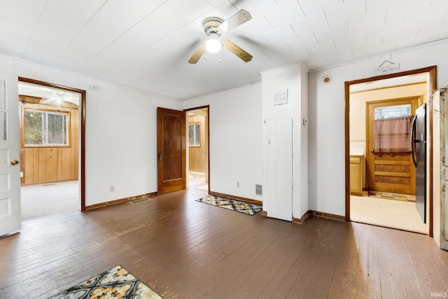 spare room with ceiling fan and dark hardwood / wood-style flooring