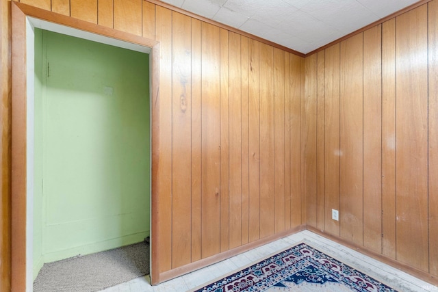 interior space featuring wooden walls