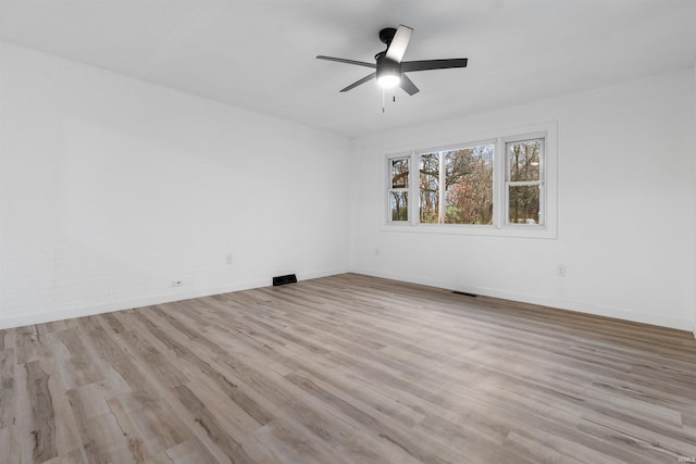 unfurnished room featuring ceiling fan and light hardwood / wood-style flooring