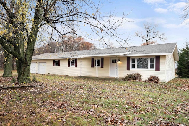 single story home with a garage