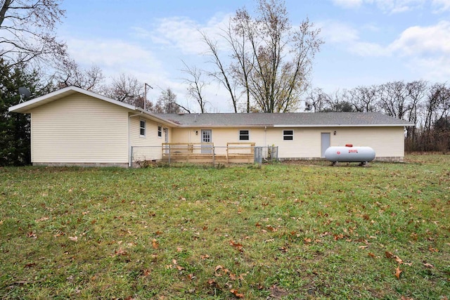 back of house with a yard