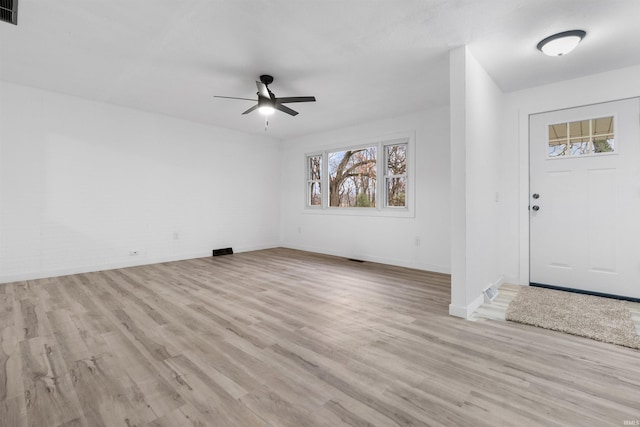 entryway with light hardwood / wood-style floors and ceiling fan