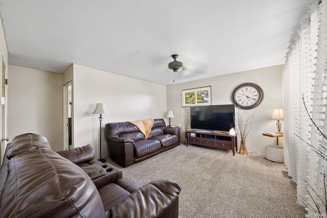 carpeted living room featuring ceiling fan