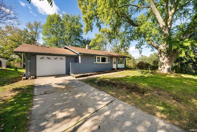 ranch-style home featuring a garage and a front lawn