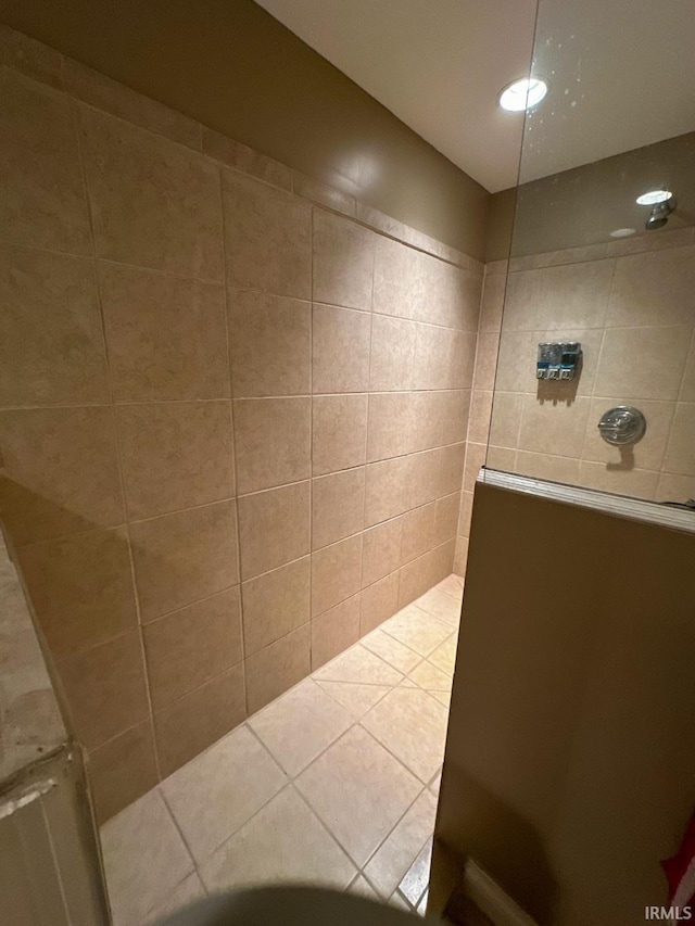 bathroom with tiled shower