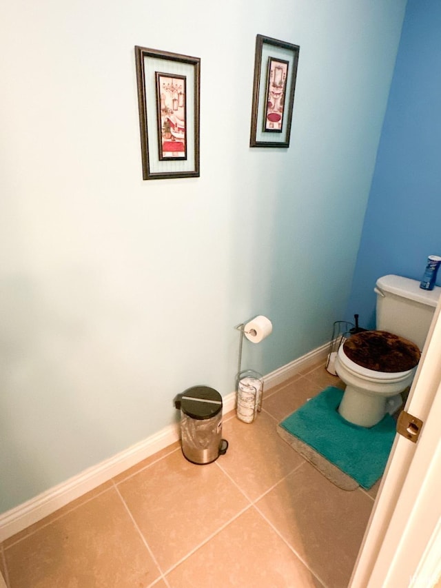 bathroom featuring tile patterned flooring and toilet