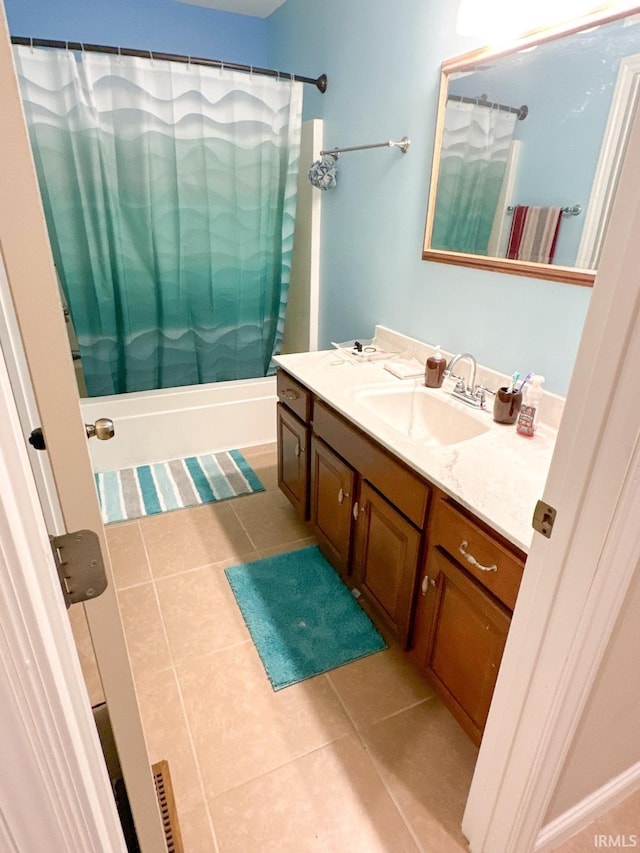 bathroom featuring vanity, tile patterned floors, and shower / tub combo with curtain