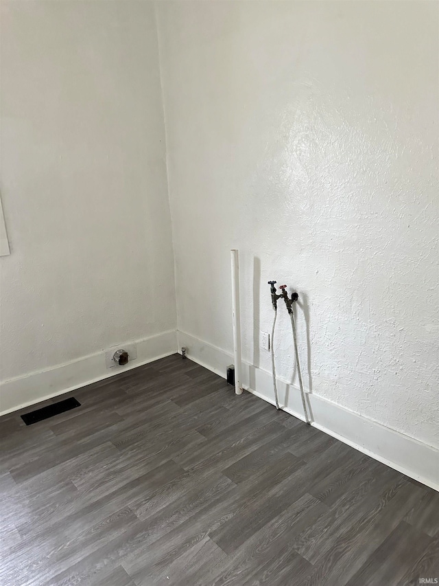 washroom with washer hookup and dark wood-type flooring