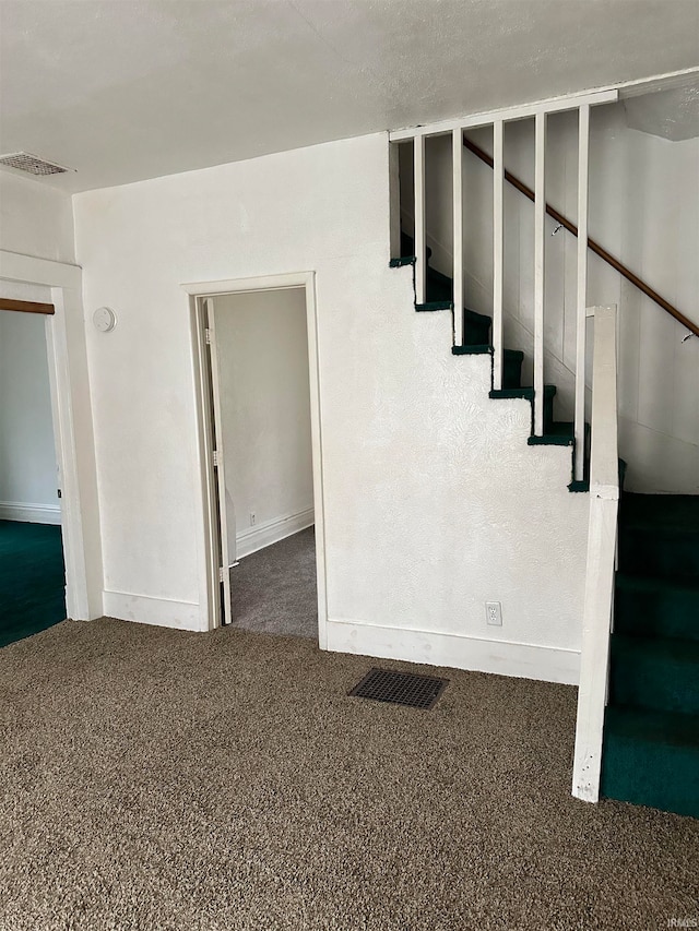 staircase with carpet