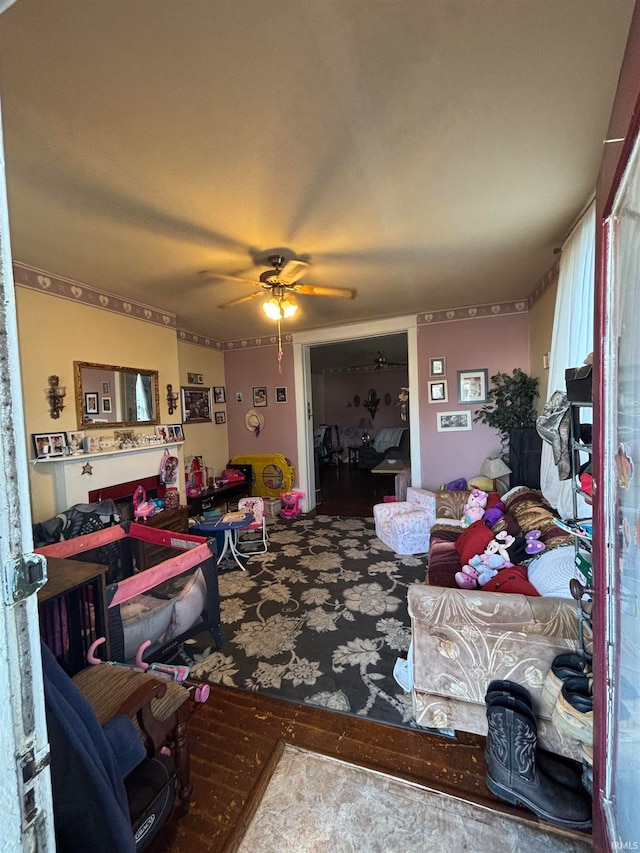 living area featuring ceiling fan