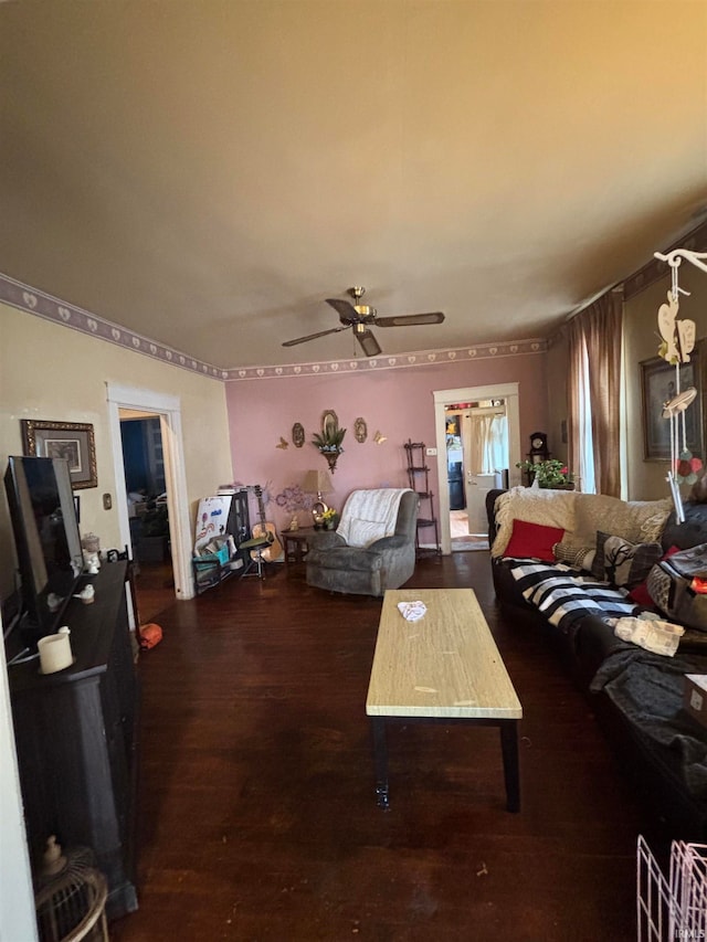 living room featuring ceiling fan and wood finished floors