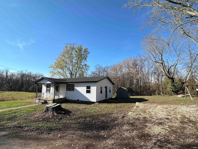 view of front of house featuring a storage shed