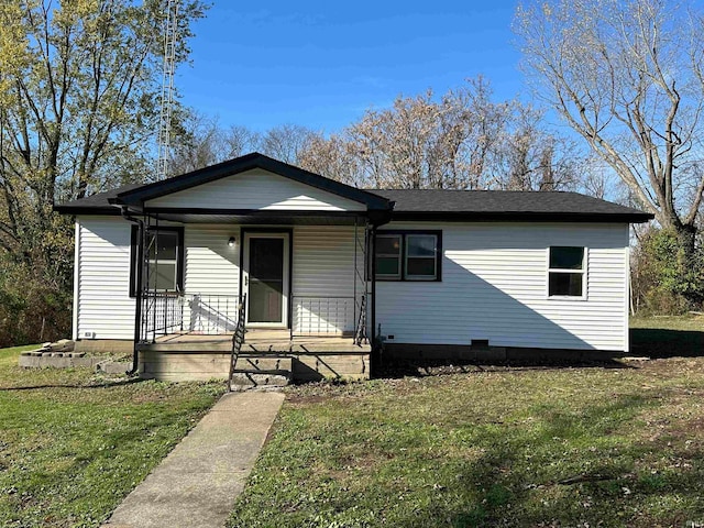 view of front of house featuring a front yard and covered porch