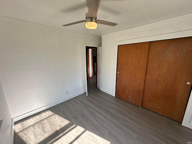 unfurnished bedroom featuring ceiling fan, light hardwood / wood-style floors, and a closet