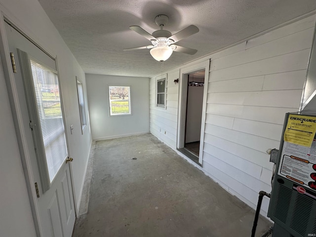 interior space featuring ceiling fan