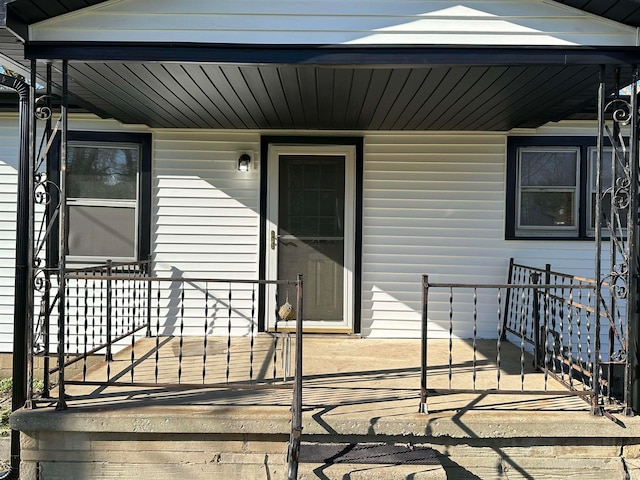 entrance to property featuring a porch