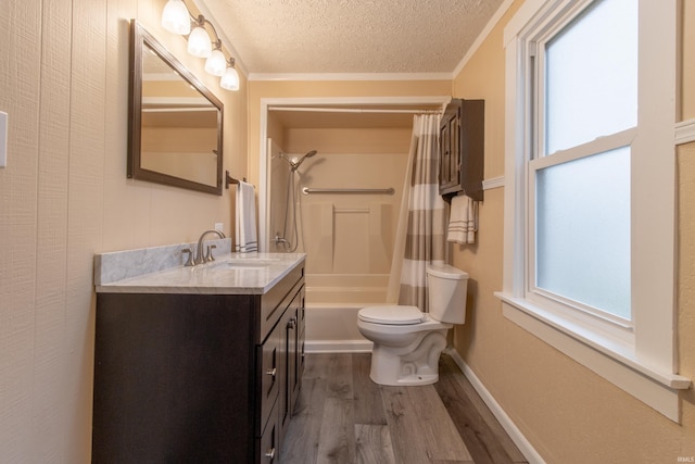 full bathroom featuring hardwood / wood-style floors, shower / bath combo, crown molding, and a textured ceiling