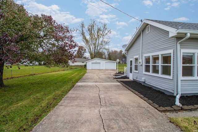 view of side of home with an outbuilding, a yard, and a garage