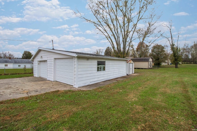 garage with a yard