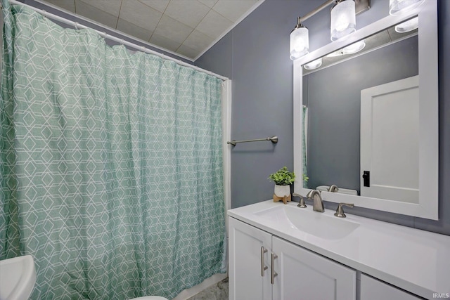 bathroom with vanity and toilet