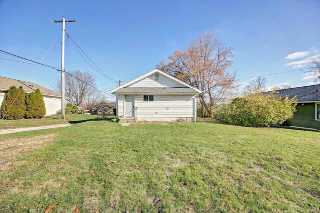 view of home's exterior with a lawn