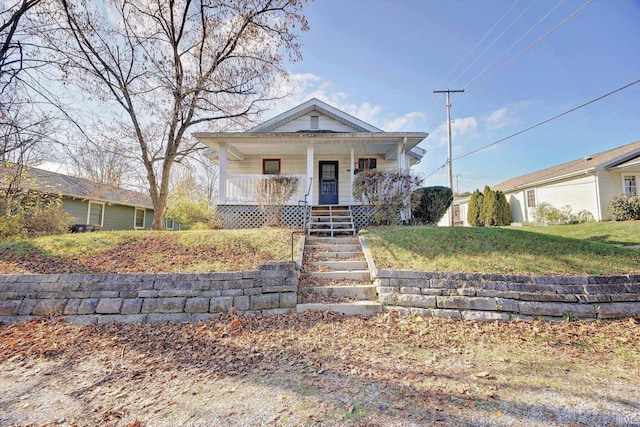 view of front of home featuring a front lawn and a porch