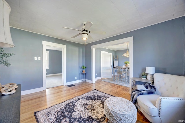 interior space featuring ceiling fan and hardwood / wood-style flooring