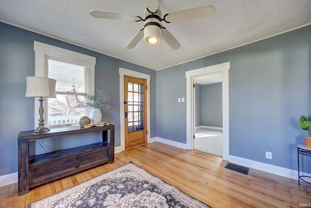 interior space with ceiling fan and hardwood / wood-style floors