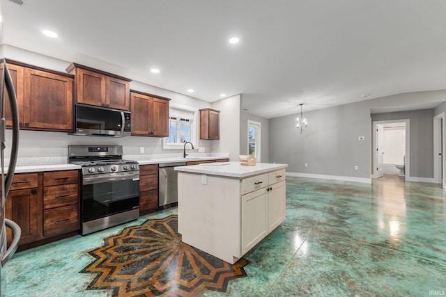 kitchen with sink, a center island, stainless steel appliances, an inviting chandelier, and pendant lighting