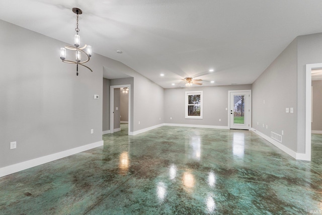 empty room featuring ceiling fan with notable chandelier