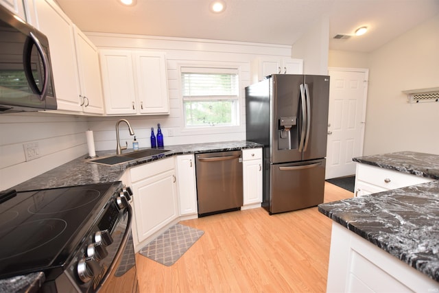 kitchen with white cabinets, sink, and stainless steel appliances