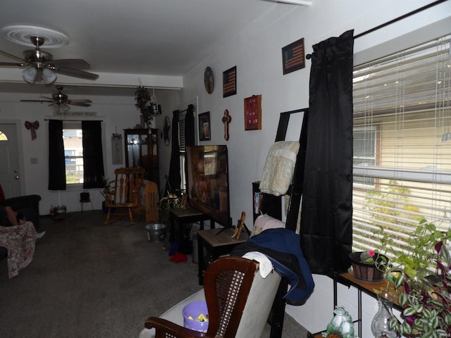 carpeted living room featuring ceiling fan