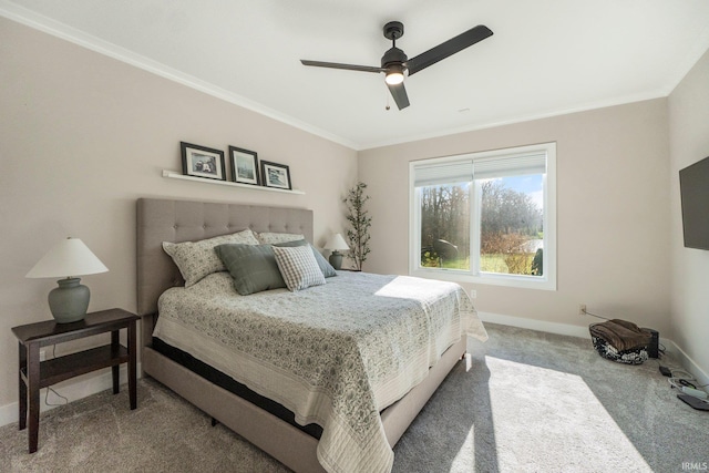 bedroom featuring carpet flooring, ceiling fan, and crown molding