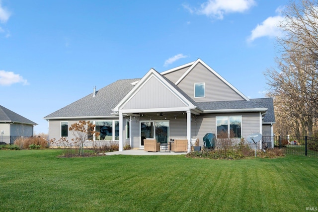 back of house with outdoor lounge area, ceiling fan, a patio area, and a lawn