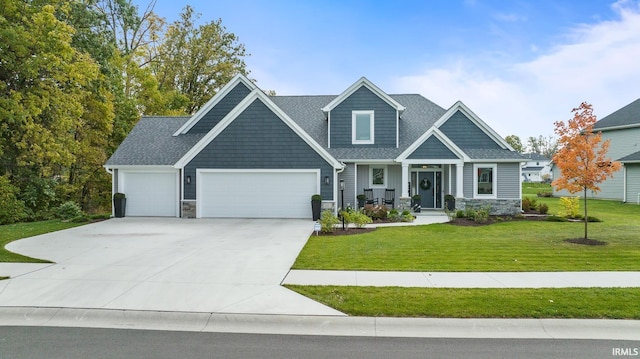 craftsman-style home featuring a front yard and a garage