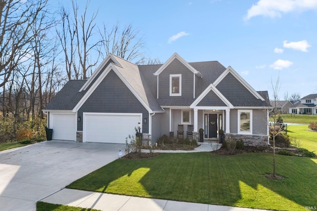 craftsman-style home with a front yard and a garage