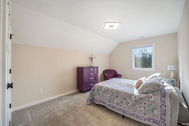 carpeted bedroom featuring lofted ceiling