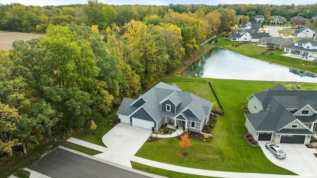 birds eye view of property with a water view