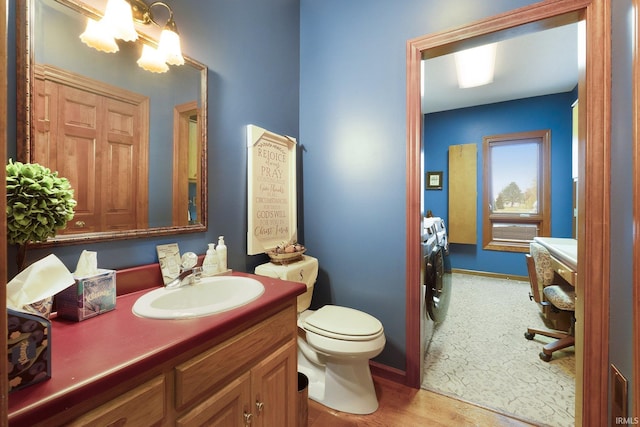 bathroom featuring hardwood / wood-style floors, vanity, and toilet