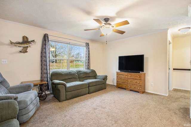 carpeted living room with ceiling fan, ornamental molding, and a textured ceiling