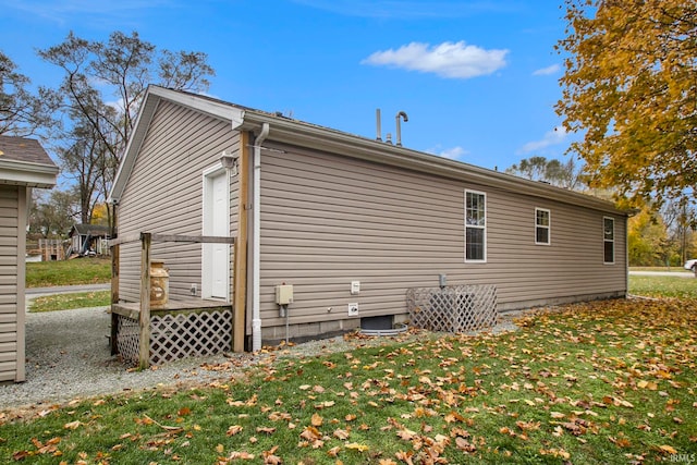 view of side of property with a yard