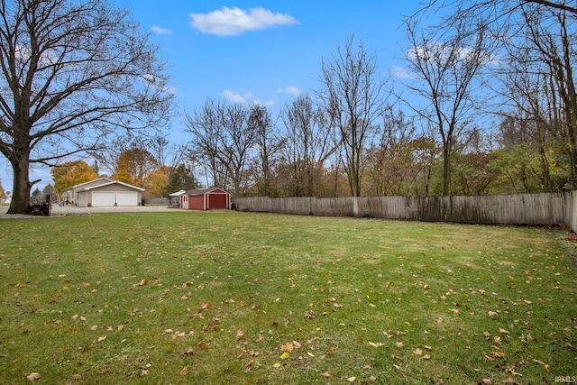 view of yard with an outdoor structure and a garage