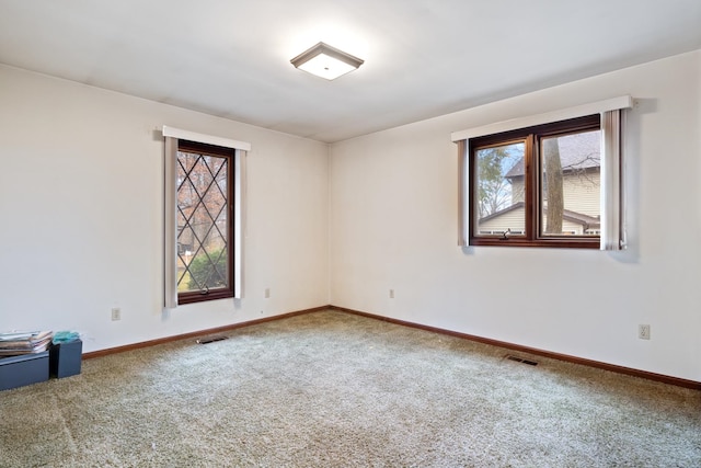 spare room with carpet floors