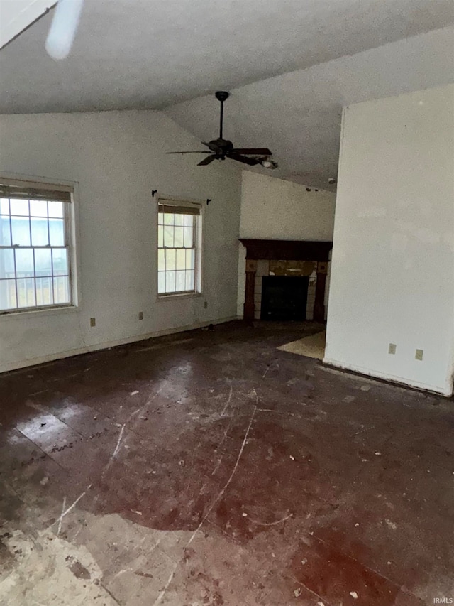 unfurnished living room with ceiling fan and lofted ceiling