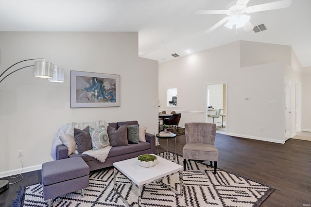 living room featuring ceiling fan, dark wood-type flooring, and high vaulted ceiling