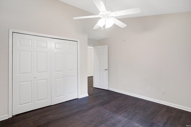 unfurnished bedroom with a closet, ceiling fan, and dark hardwood / wood-style flooring